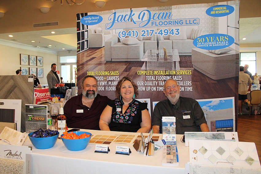 The team at Jack Dean Flooring LLC runs a booth at Meet Greet Eat. From left, Ramin and Deanna Mesghali and Jack Dean.