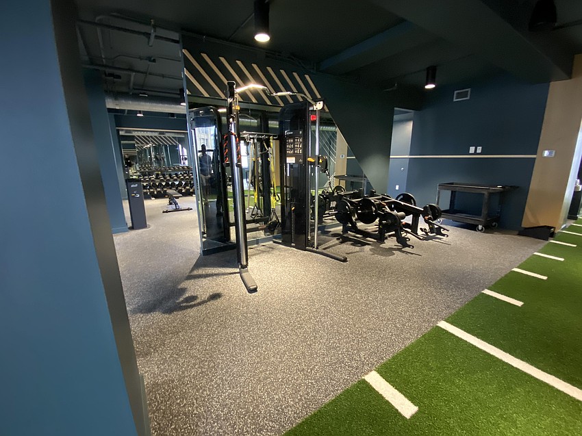 The gym in JWB Real Estate Capital's headquarters in The Greenleaf building includes weights, exercise bicycles and other workout equipment.