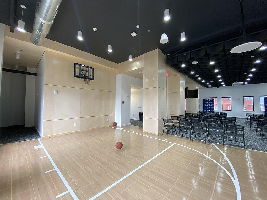 JWB Real Estate Capital employees and guests can shoot baskets on a regulation-height hoop in the 12th-floor conference and meeting room at the company's headquarters in The Greenleaf building at 208 N. Laura St.