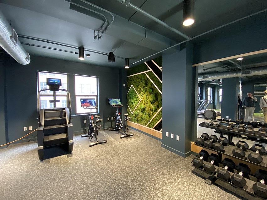 A plant-covered living wall provides both a design element and a natural air filter in the gym in JWB Real Estate Capital's headquarters at The Greenleaf in Downtown Jacksonville.