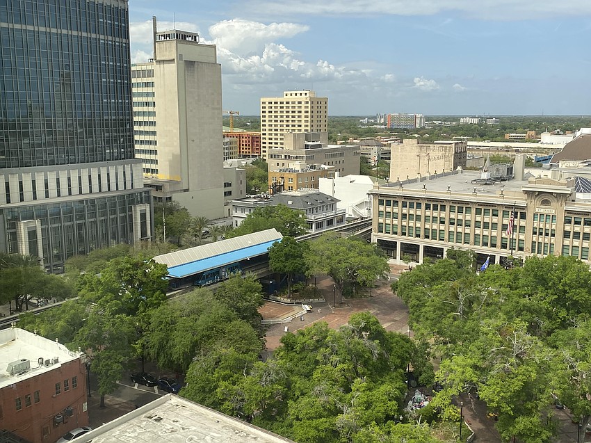 City Hall, at right, and the Bryan Simpson U.S. Courthouse, at left, are among the sights visible from the 12th story of The Greenleaf, 200 N. Laura St. The north windows also offer a view of projects in Gateway Jax's Pearl Square mixed-use development. JWB Real Estate Capital, a partner in Gateway Jax, redeveloped The Greenleaf.