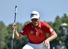 Bernhard Langer reads the 10th green before attempting a putt. The 47-time winner on the PGA Tour Champions and two-time Masters Tournament champion shot six under par in his opening round.