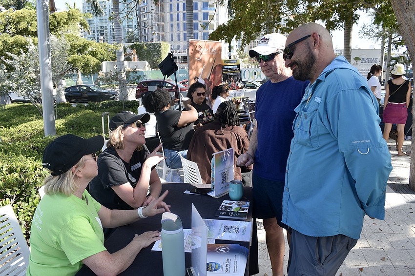 Executive Director Katherine Ceaser and Curator and Director of Exhibitions Christina Baril, of Art Center Sarasota, speak with Founding CEO AG Lafley and Landscape Technician Alec Wilhelm of The Bay.