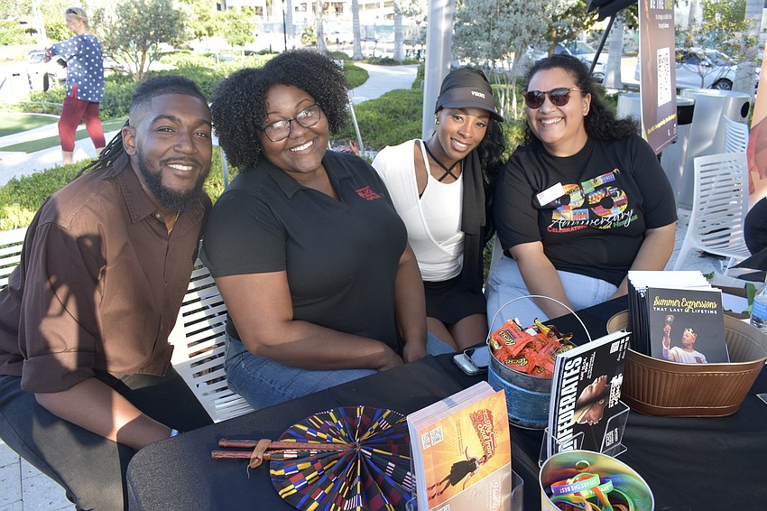Todd Bellamy II, Ki Thomas, Riki Stevens and Regina Belvin of Westcoast Black Theatre Troupe, staff their table.