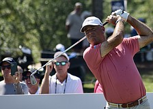Stewart Cink watches his drive off the 10th-hole tee. He sits two strokes behind the leaders entering the third round of the Senior PGA Championship, in pursuit of his first senior major title.