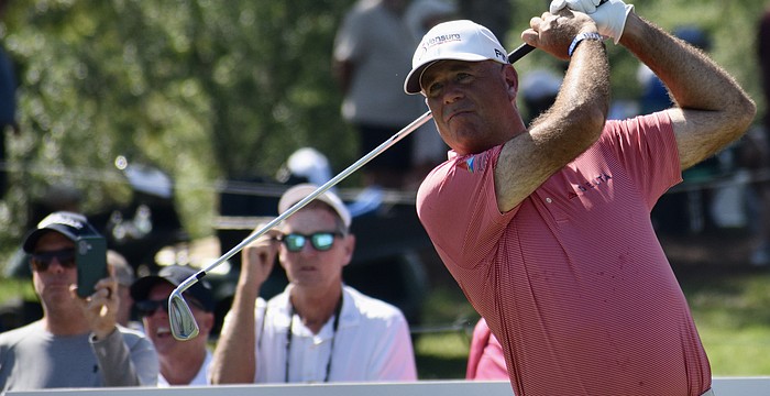 Stewart Cink watches his drive off the 10th-hole tee. He sits two strokes behind the leaders entering the third round of the Senior PGA Championship, in pursuit of his first senior major title.