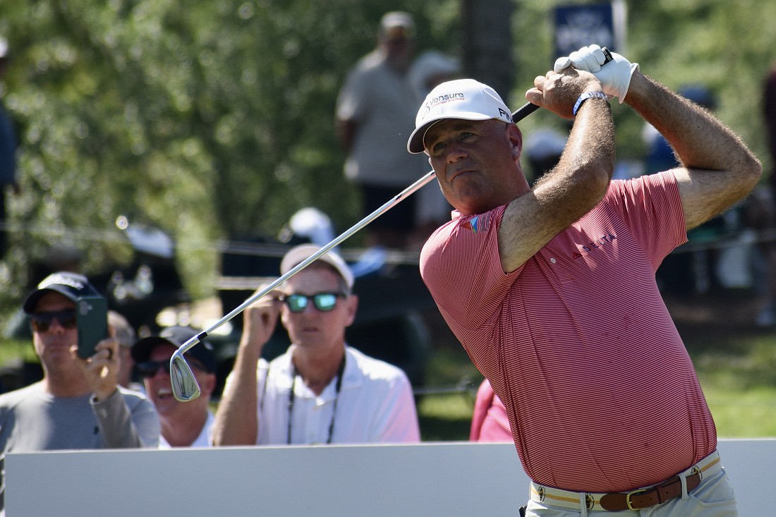 Stewart Cink watches his drive off the 10th-hole tee. He sits two strokes behind the leaders entering the third round of the Senior PGA Championship, in pursuit of his first senior major title.