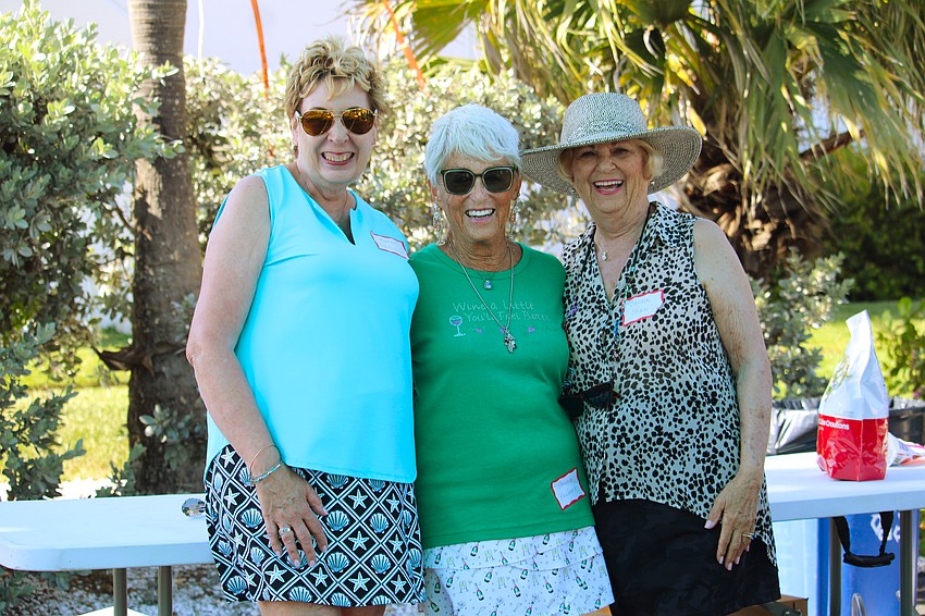 Karen Pashkow, Connie Haubert DiMaggio and Carole Shaw share a smile at the Longboat Harbour annual farewell pizza party.