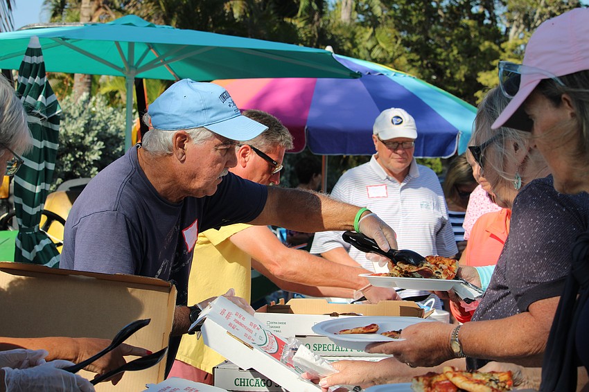 Fresh pizza dished up by Tom Guido and others was on the menu at the popular annual farewell party at Longboat Harbour.