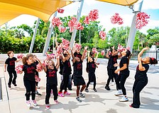 Girls celebrate Girls Inc. outside feeling victorious after their welcome song.