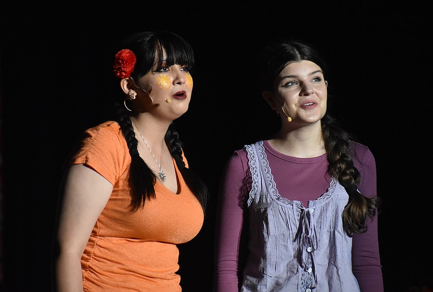 Freshman Sarah Vargas and sophomore Polly Jessop sing 