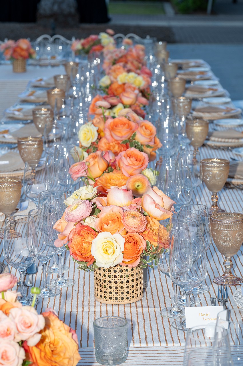 Beautiful centerpieces line the table.