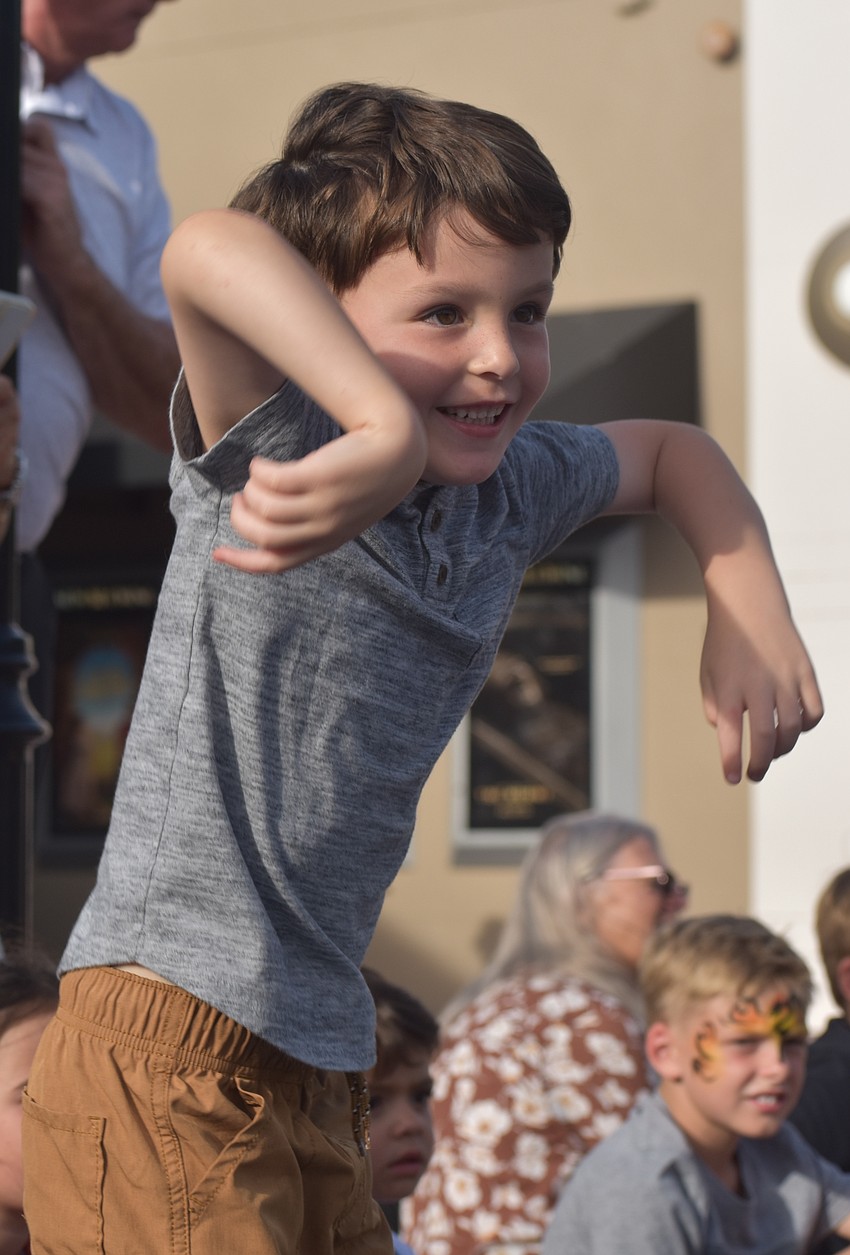 Lakewood Ranch's Nolan Pendola, 5, dances to the music of the Puppy Pals Live show at Woofstock on Lakewood Main Street.