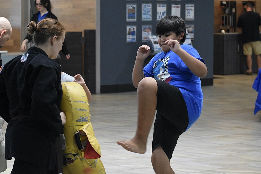 Elizabeth Hall of Cypress Pillar Healing Arts teaches Ian Lopez, 10.