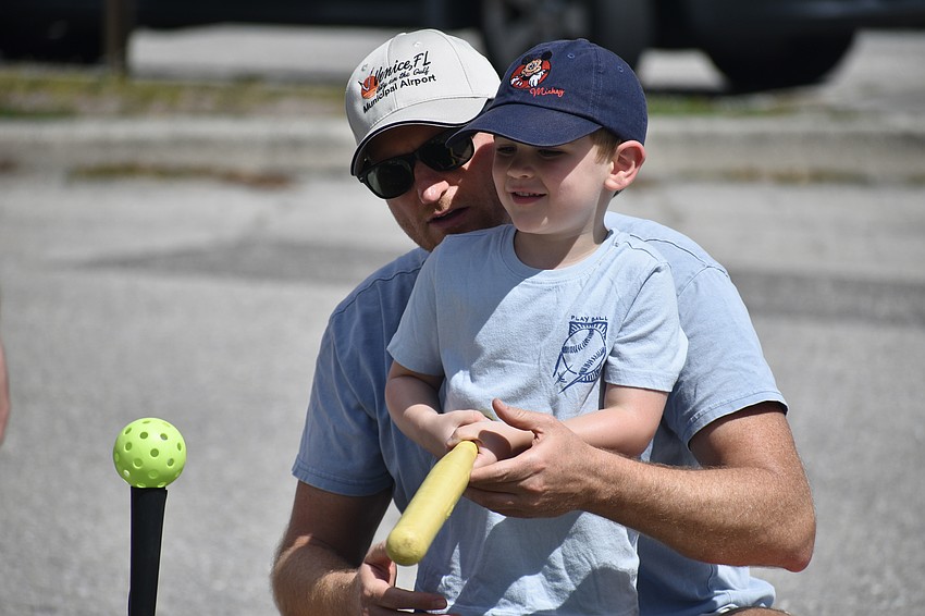 Brad Morrison and his son Declan Morrison, 3, practice baseball with The Sports Farm.