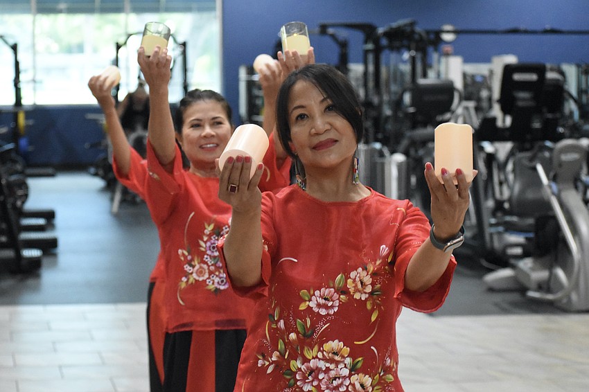 Maria Jennings and Lynne Cook lead the way in a performance of the Philippine folk dance Pandanggo sa Ilaw (Dance of Lights).