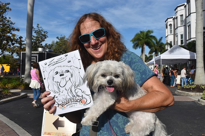 Nokomis's Holly Williams says the free caricature she had done at Woofstock really captured the smile and personality of her dog Zuzu.
