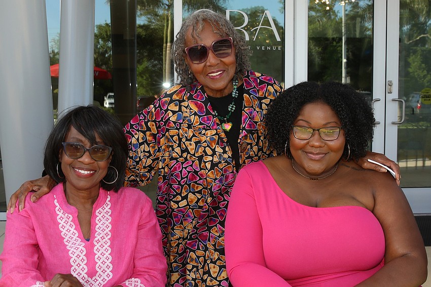 Yvette German, Christine Felton and Ki Thomas help check in 323 guests.