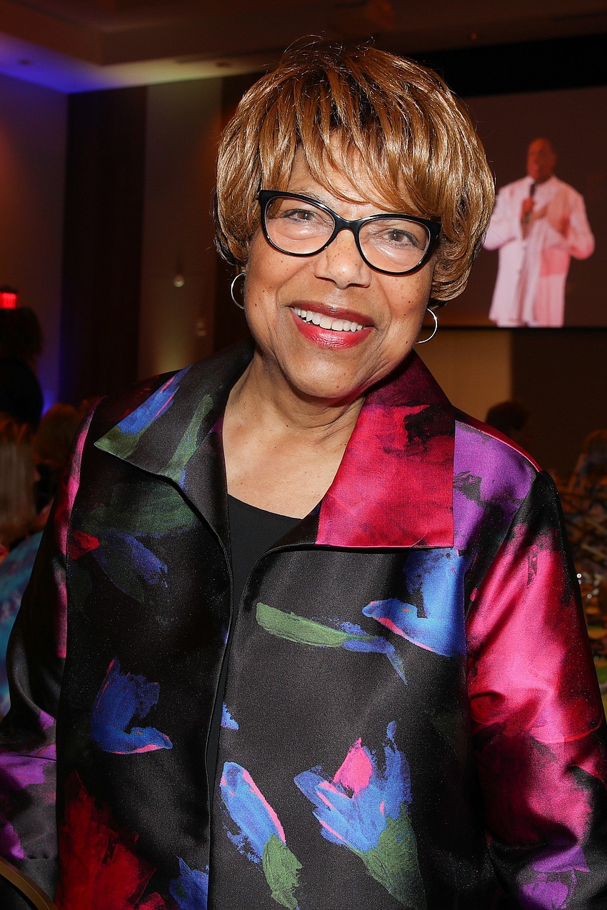 Mary Braxton Joseph with a bright smile and bold colors.