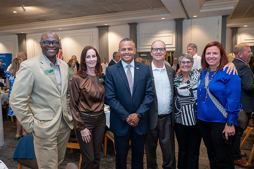 Darren Gambrell, Lisa Baker, Director of Campus Engagement for Veteran Success and Alumni Affairs Veteran Advocate of the Year Awardee Carlos Moreira, Brett Kempker, Marrie Neumer and Cheryl Fainelli