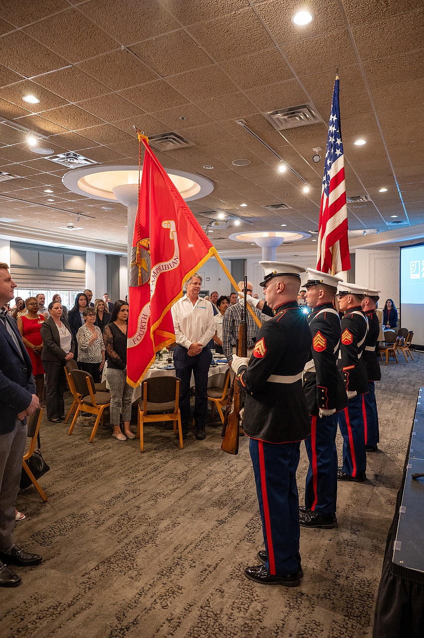The presentation of colors by the colorguard.