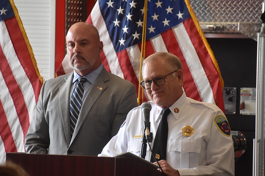 Florida CFO Blaise Ingoglia stands behind East Manatee Fire Rescue's Chief Lee Whitehurst during the April