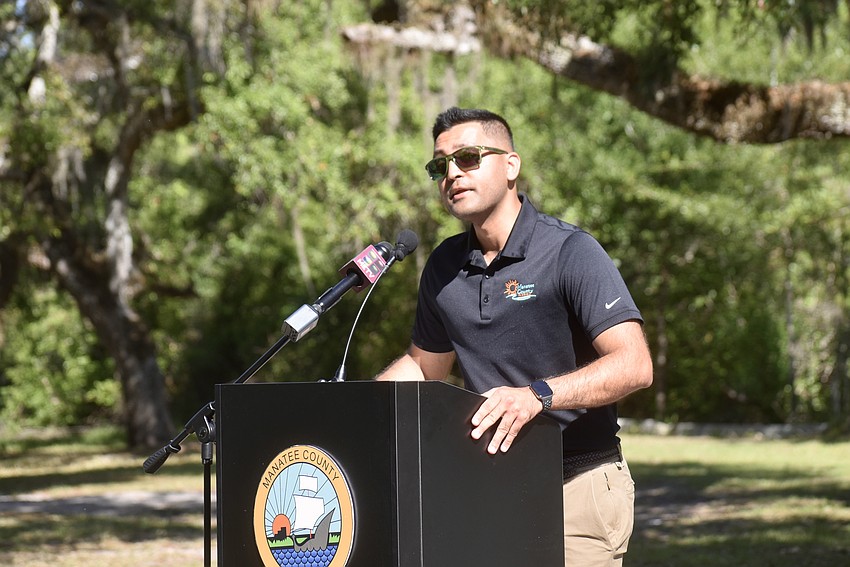 Commission Chair Tal Siddique serves as the memorial's emcee.