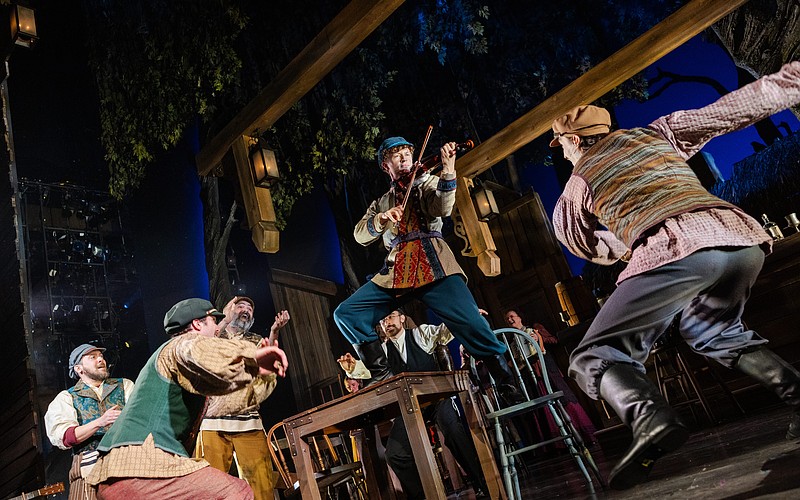 Maxim Chlumecky is at the center of the action in this scene from Asolo Rep's "Fiddler on the Roof," which runs through May 24 at FSU Center for the Performing Arts.