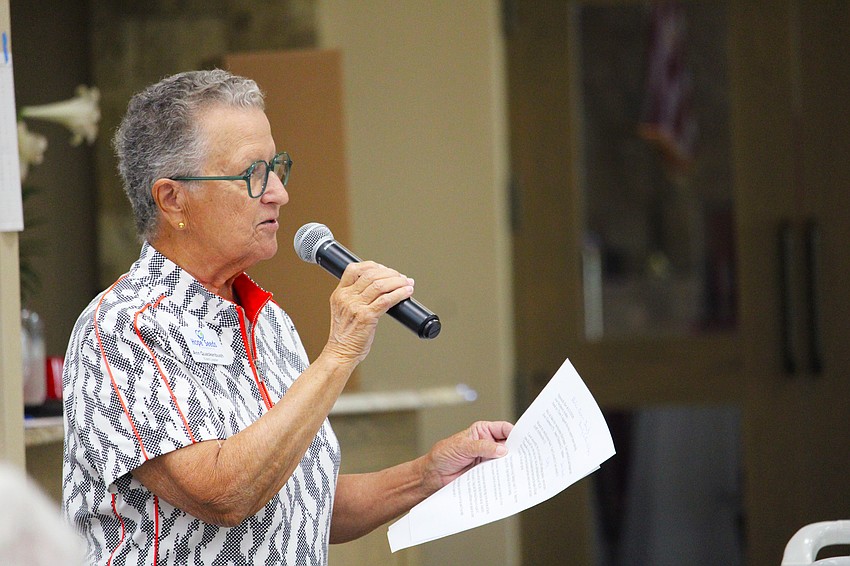 Ann Quackenbush, one of the organizers of the local Hope Seeds chapter, gives updates on missionaries delivering seed packets to farmers in Uganda and Rwanda at the April 13 packing event, the last of this season.