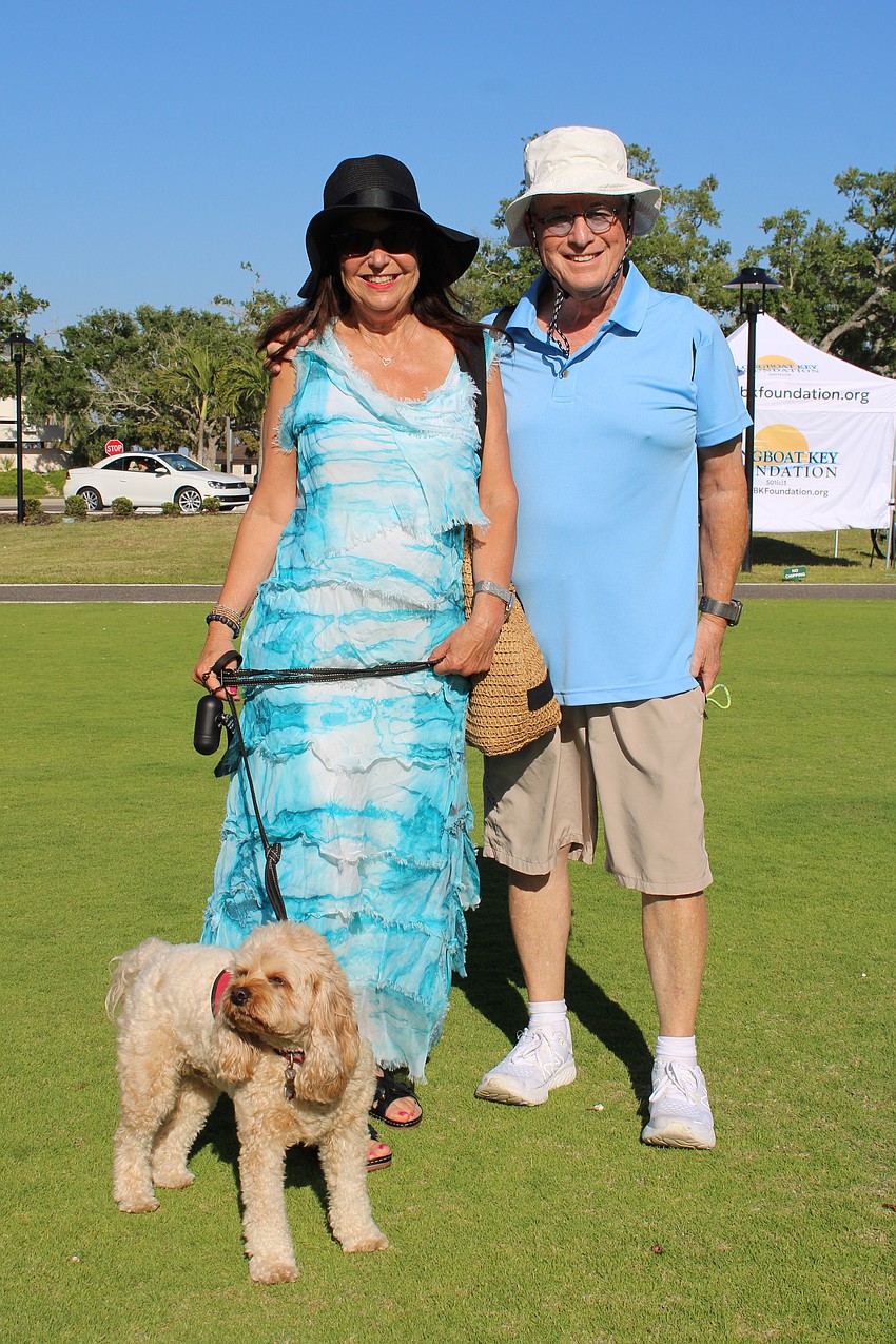 Barbara and Bob Davis, joined by Hershey, show their support for the Longboat Key Garden Club by attending the second-annual Comedy Night.