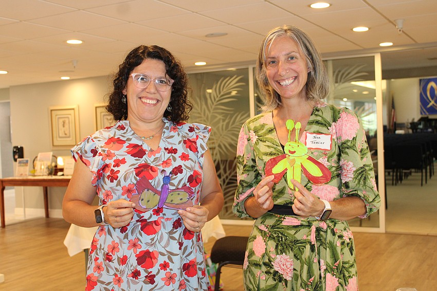 Kindergarten teacher Lydia Sanpedro and Parent Teacher Council board member Jessica Tessier from Dreamer's Academy showcase fantastic butterfly thank-you cards from students to the Longboat Key Garden Club.