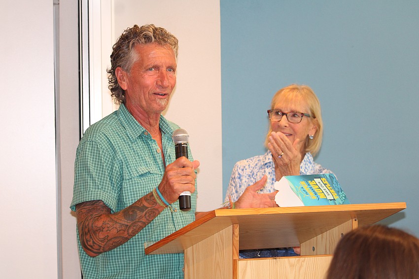 Longboat Key Garden Club grant coordinator Linda Ulrich applauds the rebuilding efforts of Save Our Seabirds described by Leo Kissling.