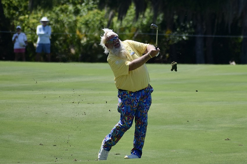 John Daly hits his approach shot on the 17th-hole fairway at The Concession. He won The Open Championship in 1995 and the PGA Championship in 1991.