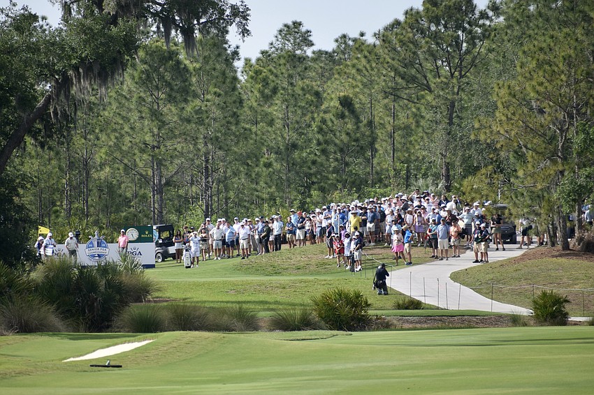 Spectators surround Stewart Cink by the 18th-hole tee in anticipation of his winning moment. It was a drama-free finish with Cink leading by six strokes over Ben Crane.