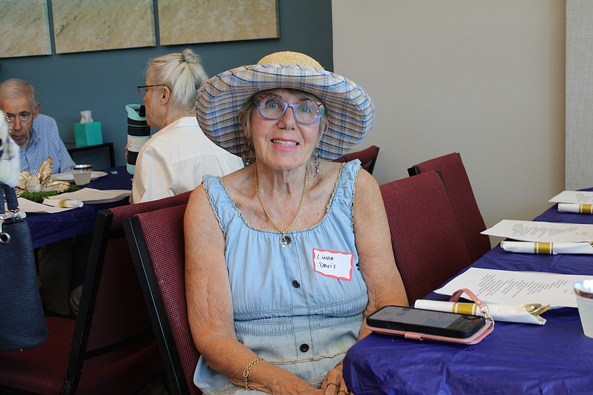 Longboat Key Garden Club member Linda Davis sports a fetching hat for the club's annual Arbor Day meeting.