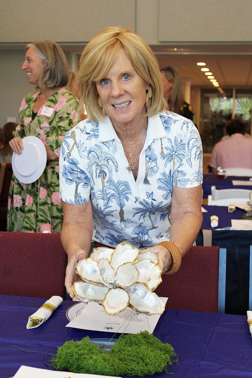 Susan DiNatale crafted the shell-based table centerpieces that raffle winners took home from the Longboat Key Garden Club annual awards luncheon.