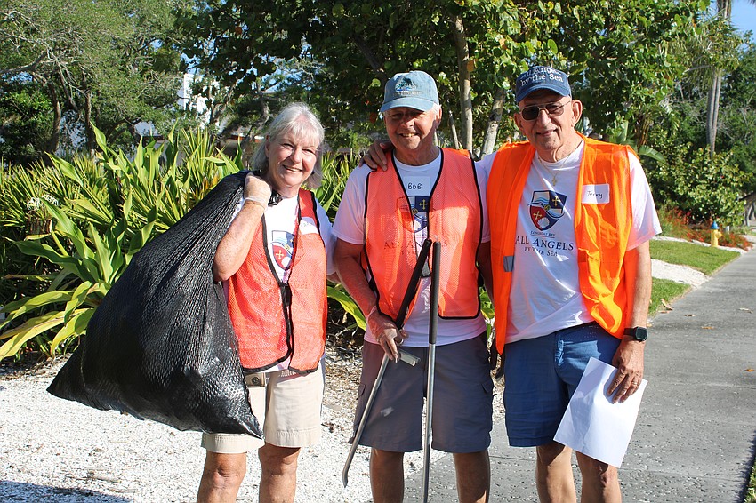 Carol and Bob Erker and Terry Cobb from All Angels by the Sea Episcopal Church lend a hand.
