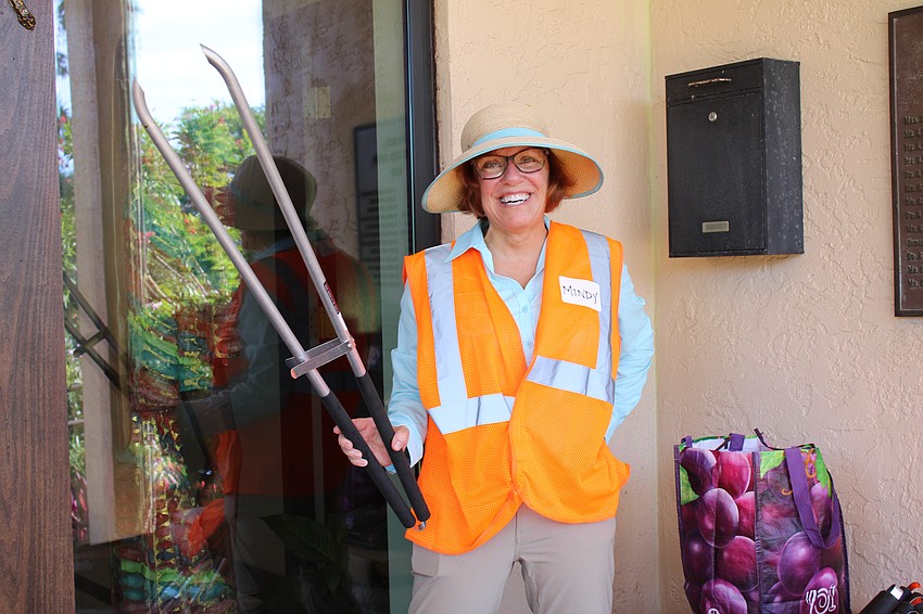 Volunteer Mindy Brandt welcomes clean-up crews back to Temple Beth Israel for breakfast.