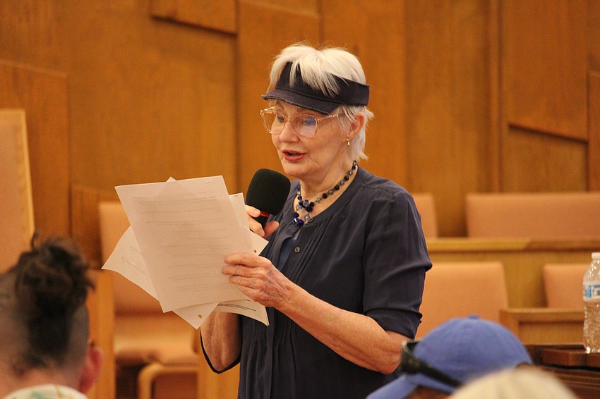 Temple Beth Israel Choir Soloist Kei Sulhi starts the Saturday morning interfaith service by leading a group singing of 
