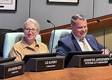 Patrick Robinson at the dais with Interim City Manager Jennifer Jorgensen during a recent City Commission meeting.