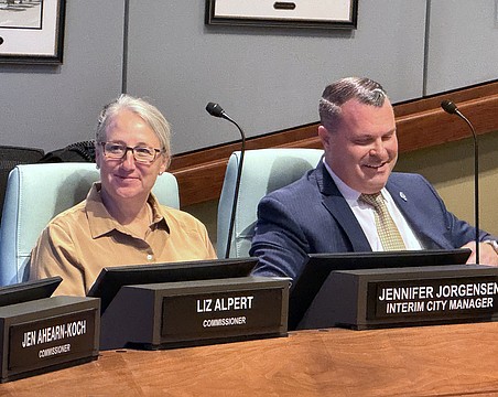 Patrick Robinson at the dais with Interim City Manager Jennifer Jorgensen during a recent City Commission meeting.
