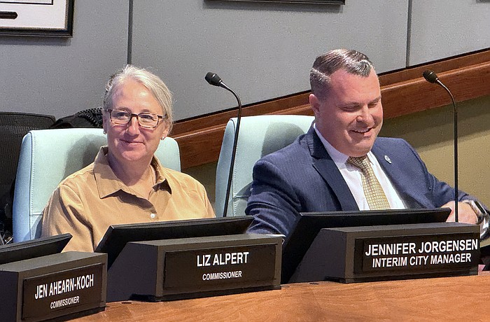 Patrick Robinson at the dais with Interim City Manager Jennifer Jorgensen during a recent City Commission meeting.