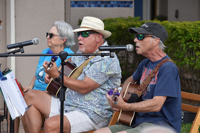 Lynn Cassell, Mike Lawless and Michael Cohen perform.