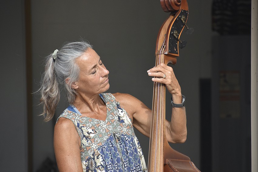 Angie Eason plays the bass.