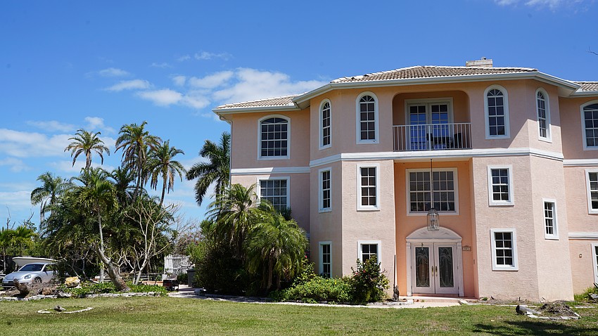 The pink house at 501 General Harris Street has received more than $50,000 in code violations from the town of Longboat Key.