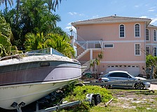 The house at 501 General Harris Street has received attention from neighbors, city code enforcement, banks and courts as foreclosure of the property inches along while maintenance is lacking.
