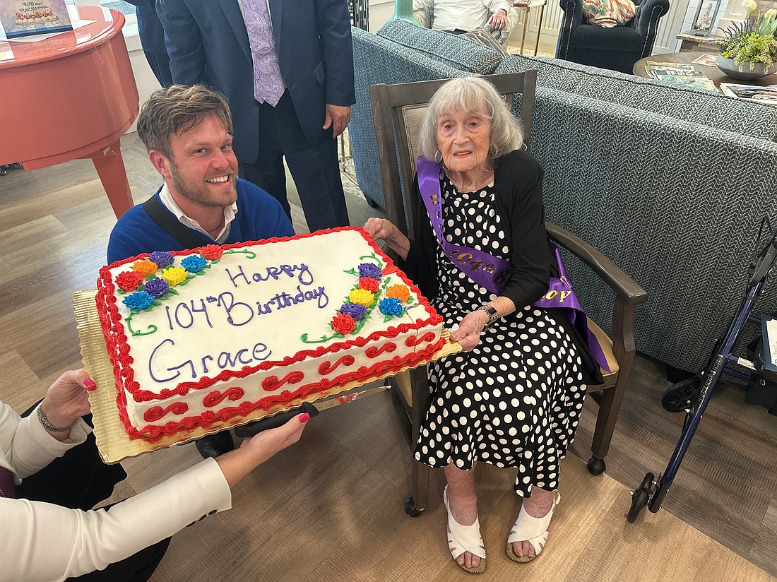 Grace Miller celebrates her 104th birthday with a cake during a gathering at Sancerre at Palm Coast Assisted Living and Memory Care. Photo by Rich Carroll.