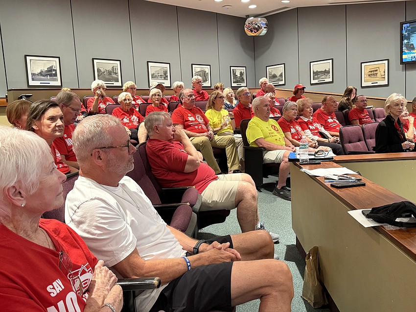 Red shirt-wearing opponents of Obsidian have frequently attended Sarasota City Commission meetings since 2023.
