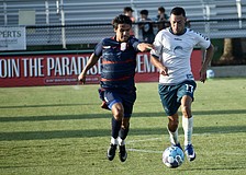 Forward Jonathan Bolanos (right) dribbles with a defender on his tail during the Sarasota Paradise's match vs. Corpus Christi FC on April 22. It was the team's first win this month, and second in seven games played.