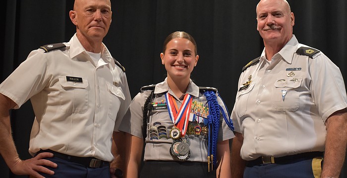Elisa Massaro, a senior and battalion commander of the Lakewood Ranch High School Junior Reserve Officers' Training Corps, is glad to have had the support of her teachers Richard Roller and William Cassidy.